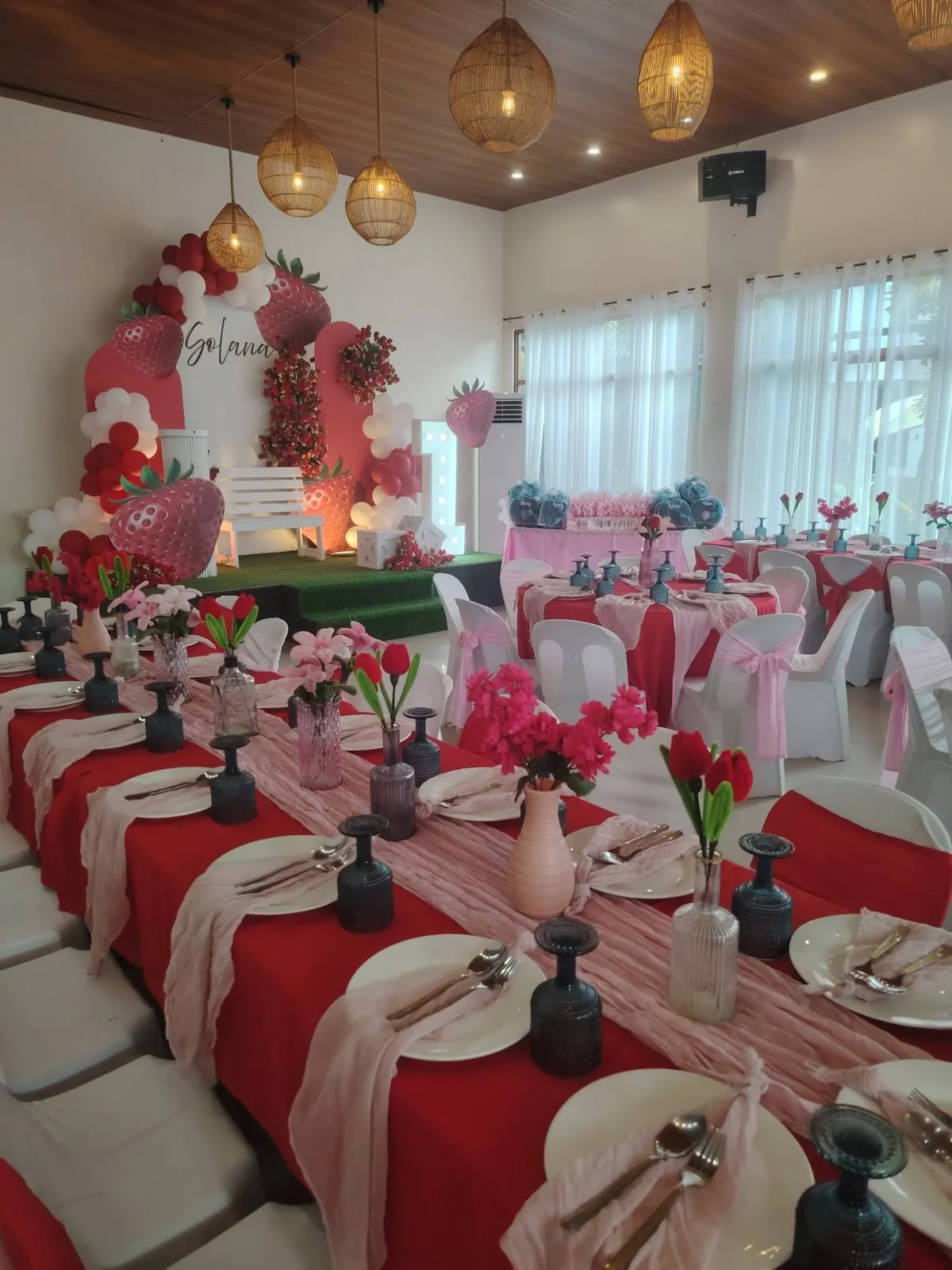 Red and blush debut tables in the hall
