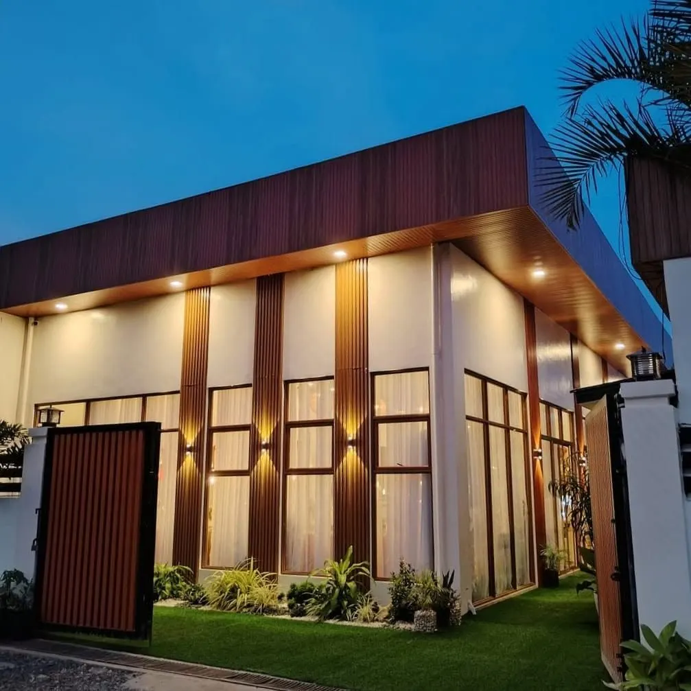 The villa entrance lit up at dusk