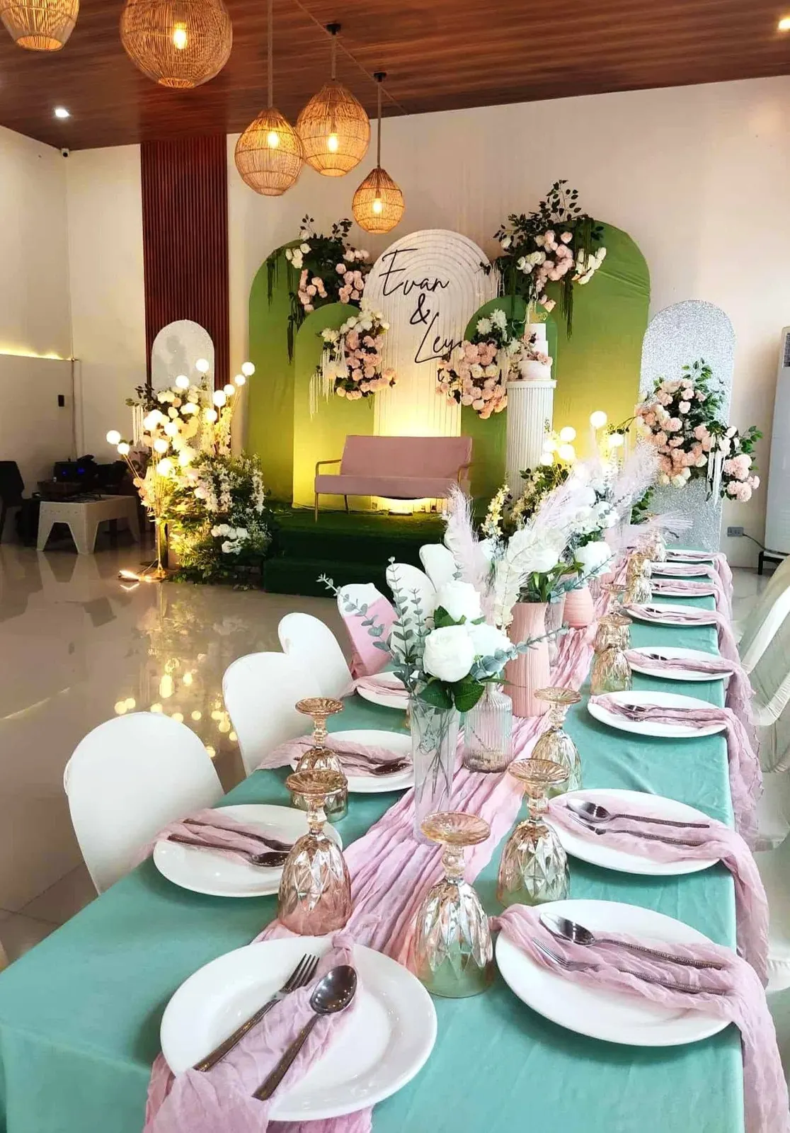 Mint and blush tables in the hall