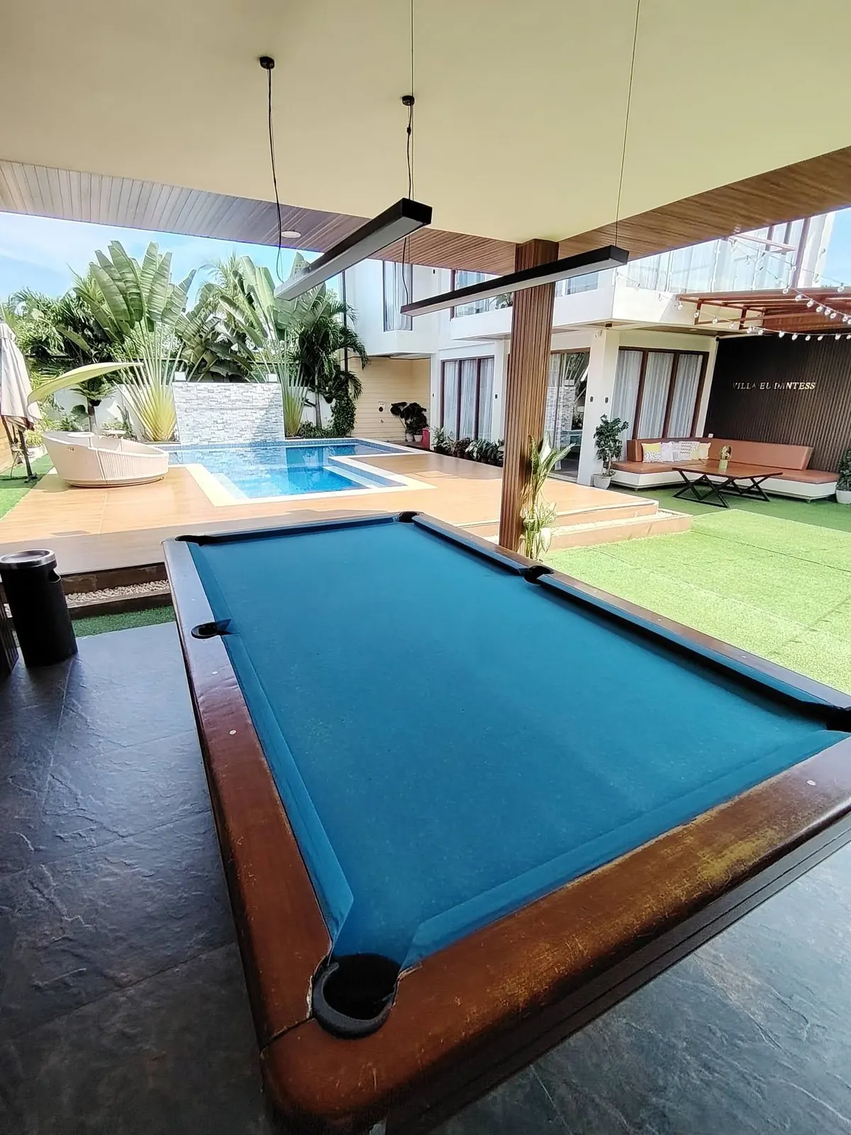 Billiards table beside the pool