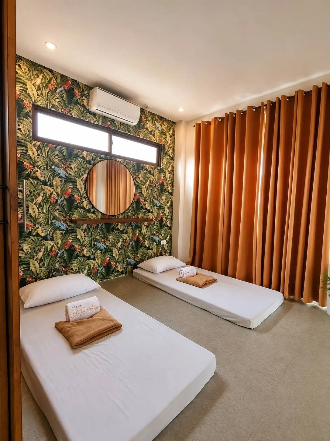 Bedroom with a tropical leaf wall